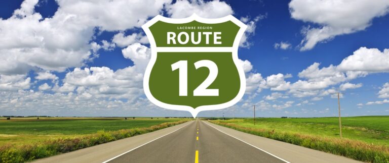 Highway through the prairies with Lacombe Regional Route 12 sign