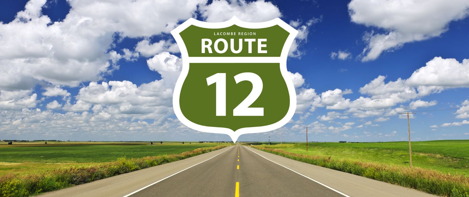 Highway through the prairies with Lacombe Regional Route 12 sign
